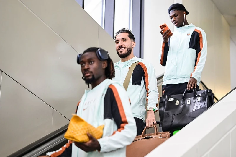 Team France players arriving for the World Cup carrying Hermès Birkin and Kelly bags