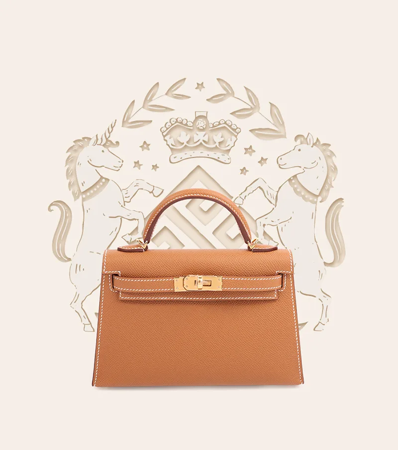 Hermès tan Kelly handbag over a heraldic crest